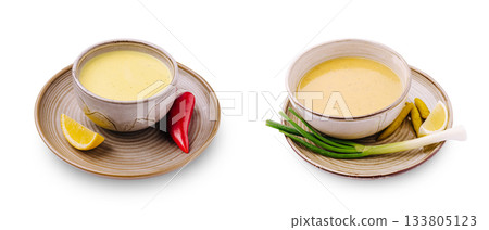 Tasty broth bowls with fresh ingredients served on simple dishes 133805123