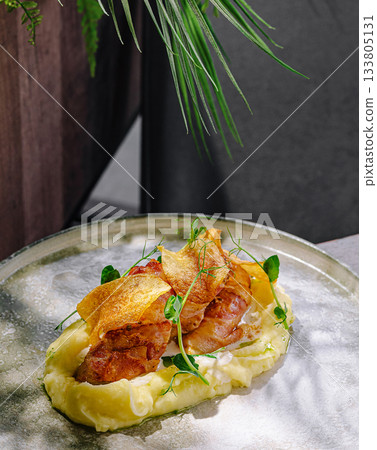 Delicious gourmet dish featuring crispy chicken on creamy mashed potatoes Delicious gourmet dish featuring crispy chicken on creamy mashed potatoes 133805131