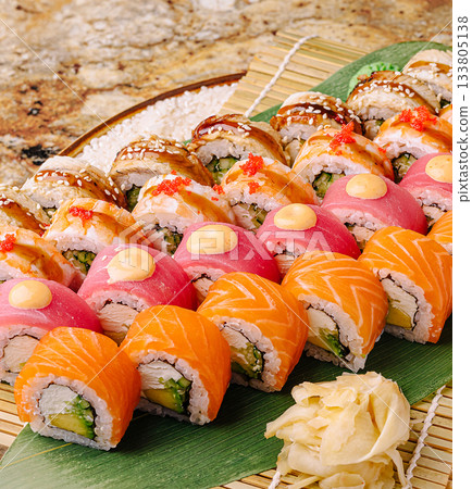 Colorful sushi platter served with ginger and wasabi at a restaurant Colorful sushi platter served with ginger and wasabi at a restaurant 133805138