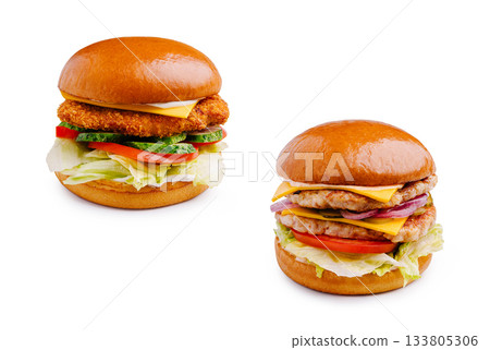 Delicious burgers featuring crispy chicken and grilled meat with veggies Delicious burgers featuring crispy chicken and grilled meat with veggies 133805306