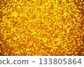 Golden yellow background with shimmering bokeh lights for design. Golden glowing orbs create festive, luxurious, and elegant mood perfect for celebration or holiday themes. 133805864