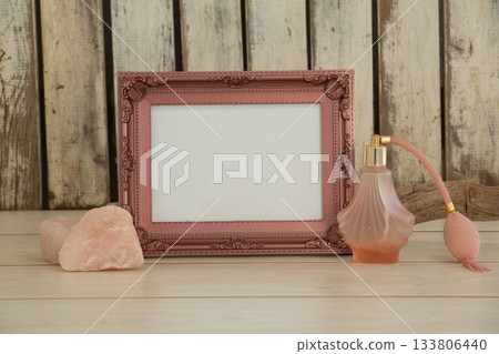 Photo frame and camera on table Photo frame and camera on table 133806440