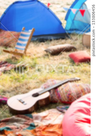 Tents by guitars and chairs 133806456