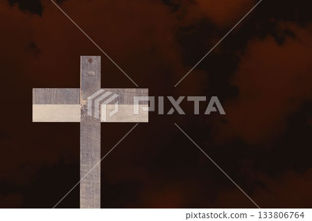 Weathered wooden cross is standing against red brown cloudscape, in flat design illustration 133806764