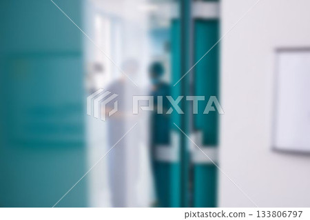 Two surgeons interacting with each other in corridor Two surgeons interacting with each other in corridor 133806797