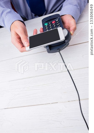 Man using smartphone to express pay Man using smartphone to express pay 133806849