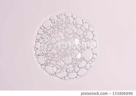 Sample of the foam of shower gel or soap suds or shaving foam. Cosmetic skin care product. Macrophotography. 133806890
