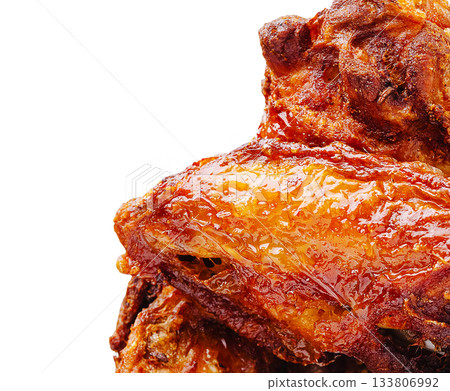 Crispy grilled chicken wings served during a summer backyard barbecue Crispy grilled chicken wings served during a summer backyard barbecue 133806992