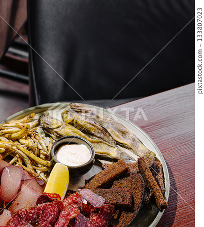 Delicious variety of seafood and meats served on a platter Delicious variety of seafood and meats served on a platter 133807023