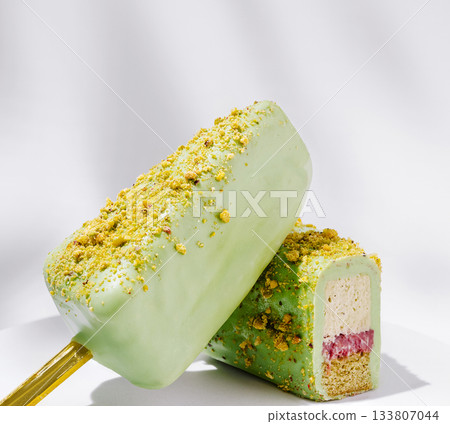 Vibrant frozen treat with layered flavors and a crunchy topping 133807044