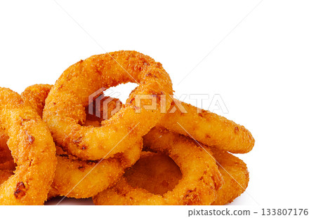 Crispy onion rings piled on a white background ready to eat Crispy onion rings piled on a white background ready to eat 133807176
