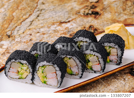 Sushi rolls with seaweed and fresh ingredients presented on a plate Sushi rolls with seaweed and fresh ingredients presented on a plate 133807207