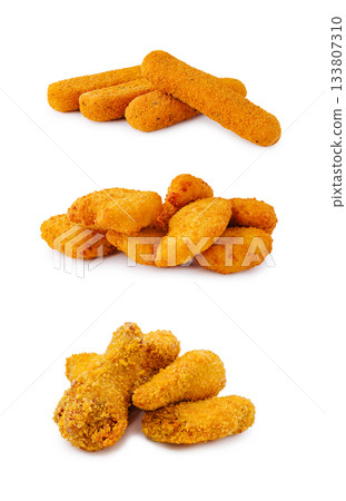 Crunchy fried snacks arranged in three layers on a white background 133807310