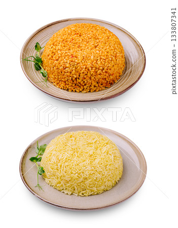 Delicious yellow rice and seasoned bulgur presented on elegant plates 133807341