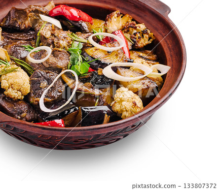 Delicious meat and vegetable dish served in a traditional clay pot Delicious meat and vegetable dish served in a traditional clay pot 133807372