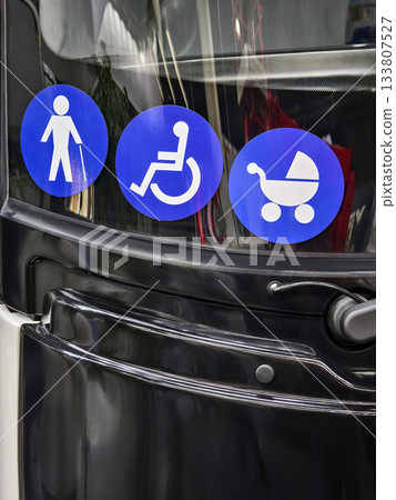 Symbols indicating accessibility features for pedestrians, wheelchair users, and strollers on public transport vehicle Symbols indicating accessibility features for pedestrians, wheelchair users, and strollers on public transport vehicle 133807527