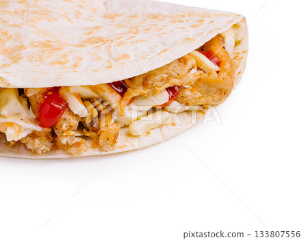 Delicious chicken wrap with fresh ingredients and spices for a tasty meal Delicious chicken wrap with fresh ingredients and spices for a tasty meal 133807556