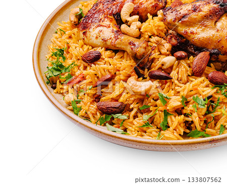 Delicious chicken and rice dish with nuts and herbs served in a bowl 133807562