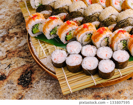 Delicious sushi platter arranged beautifully for a festive meal gathering 133807595