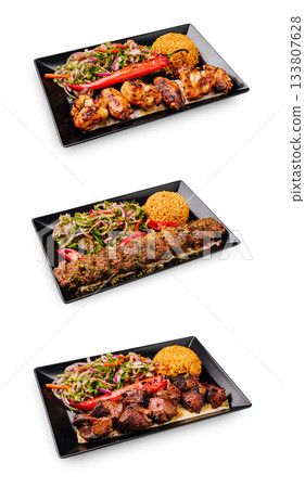 Delicious grilled dishes with rice and vegetables from a local restaurant Delicious grilled dishes with rice and vegetables from a local restaurant 133807628