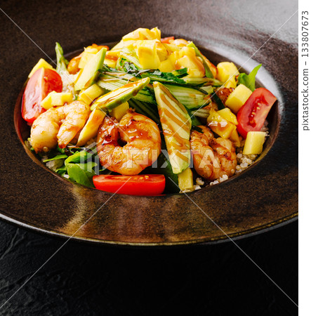 Shrimp salad bowl with fresh vegetables and mango served in a deep dish Shrimp salad bowl with fresh vegetables and mango served in a deep dish 133807673
