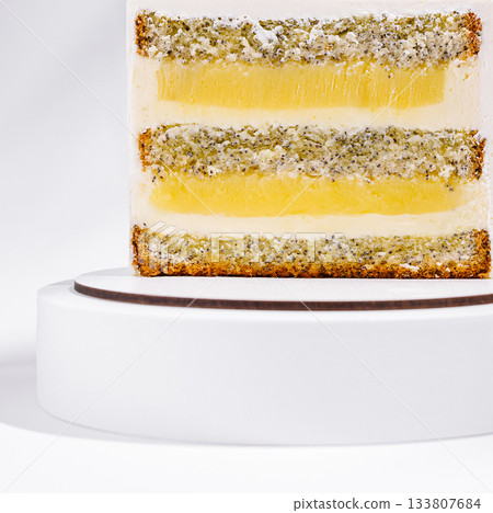 Delicious layered cake with lemon filling and poppy seed texture 133807684