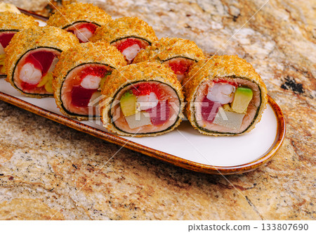 Delicious sushi rolls served on a plate at a local restaurant 133807690