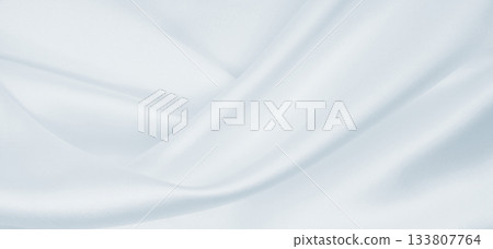 Smooth elegant grey silk or satin luxury cloth as wedding background. Luxurious background design Smooth elegant grey silk or satin luxury cloth as wedding background. Luxurious background design 133807764