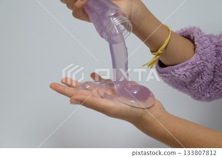 Purple slime flowing from a container Purple slime flowing from a container 133807812