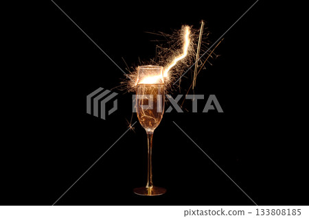 Champagne Glass with Sparkler Explosion on Black Background 133808185