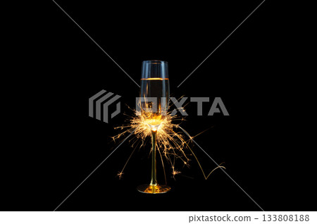 Champagne Glass with Sparkler Explosion on Black Background Champagne Glass with Sparkler Explosion on Black Background 133808188
