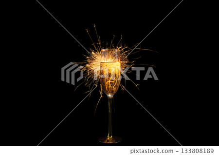Champagne Glass with Sparkler Explosion on Black Background 133808189
