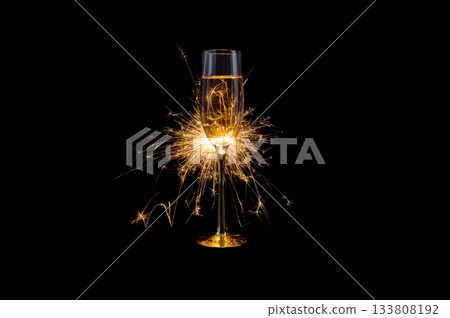 Champagne Glass with Sparkler Explosion on Black Background Champagne Glass with Sparkler Explosion on Black Background 133808192