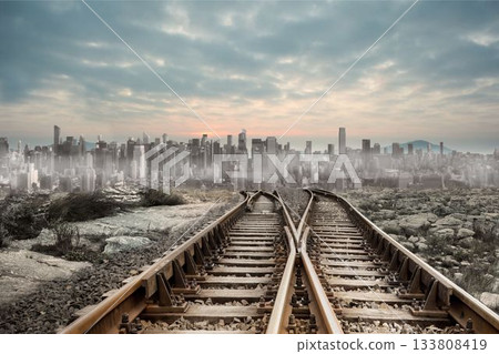 Railway tracks leading to big city 133808419
