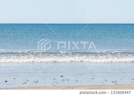 A picture of a beach with a sea background A picture of a beach with a sea background 133808447