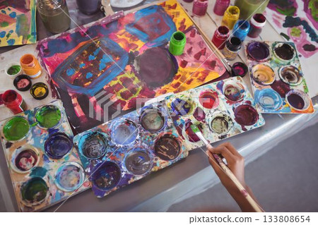 Cropped hand painting on table 133808654
