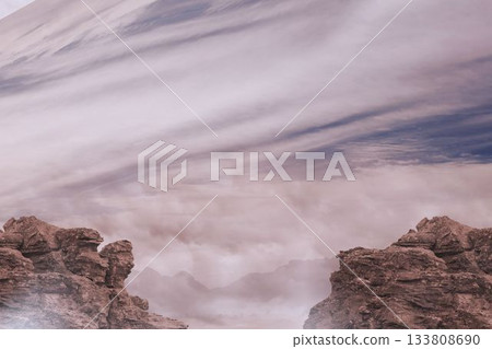 Rock outcrops are rising in flat design canyon scene, showing misty valley under pastel clouds Rock outcrops are rising in flat design canyon scene, showing misty valley under pastel clouds 133808690
