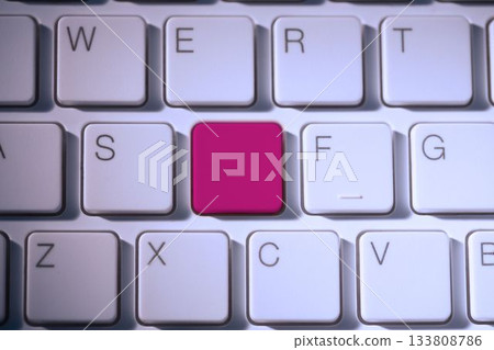 Digital composite of Pink key on keyboard 133808786