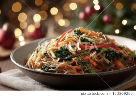 Japchae noodles served in a large ceramic dish, festive Korean New Year food Japchae noodles served in a large ceramic dish, festive Korean New Year food 133809293