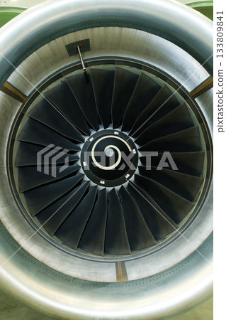 Engine turbine viewed up close, showcasing intricate design and engineering features in an aviation setting Engine turbine viewed up close, showcasing intricate design and engineering features in an aviation setting 133809841