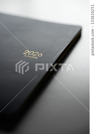 Leather-covered business planner 2026 edition 133810251