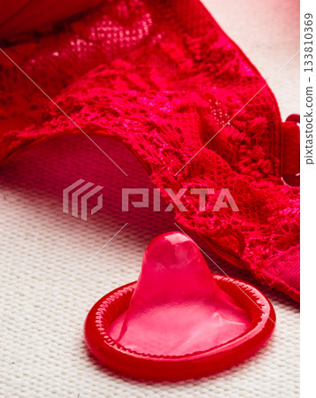 Condom with lace lingerie. Condom with lace lingerie. 133810369