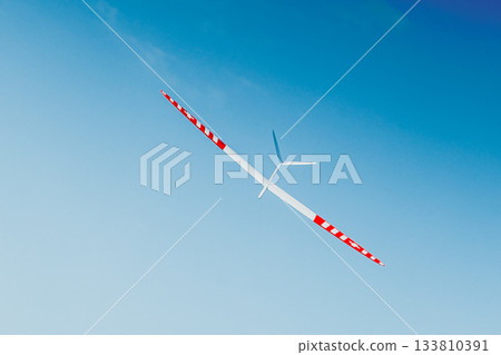 RC soaring plane on blue sky RC soaring plane on blue sky 133810391