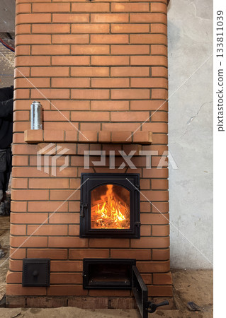 Construction of a heating stove. Test firing of the stove. 133811039