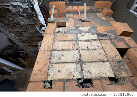 Brickwork of a heating stove. Channel ceiling. Brickwork of a heating stove. Channel ceiling. 133811062