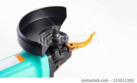 Installing the protective cover on a new grinder before use. Safety precautions, white background, isolated. Copy space for text, close-up Installing the protective cover on a new grinder before use. Safety precautions, white background, isolated. Copy space for text, close-up 133811300
