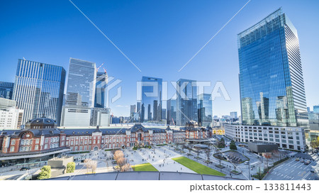 Urban scenery in front of Tokyo Station under a clear blue sky: Yaesu buildings and Tokyo Station building [Chiyoda Ward, Tokyo] 133811443