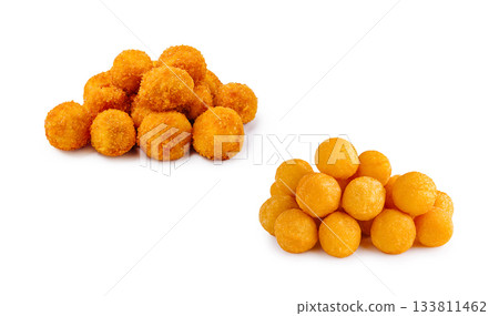 Tasty golden cheese balls stacked in two groups on a white background 133811462
