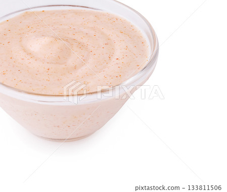 Creamy sauce in a glass bowl with a smooth texture and light color Creamy sauce in a glass bowl with a smooth texture and light color 133811506
