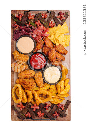 Tasty snack platter with wings, dips, and treats for gatherings Tasty snack platter with wings, dips, and treats for gatherings 133811581